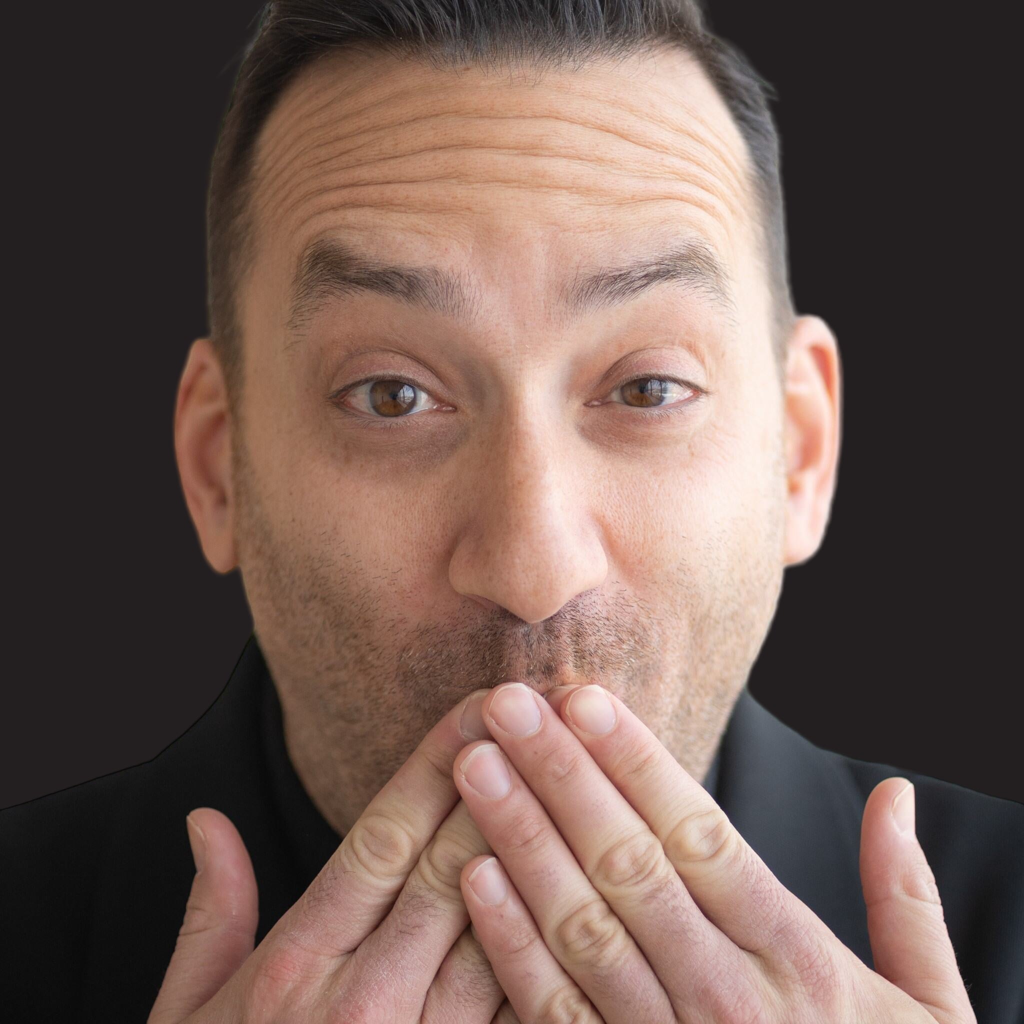 Brandon Svarc with hands over mouth